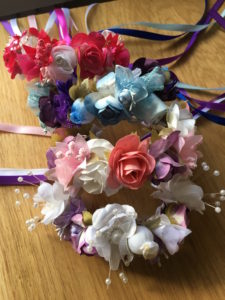 Different color's of Flower wreaths made by Ribbons On Top.